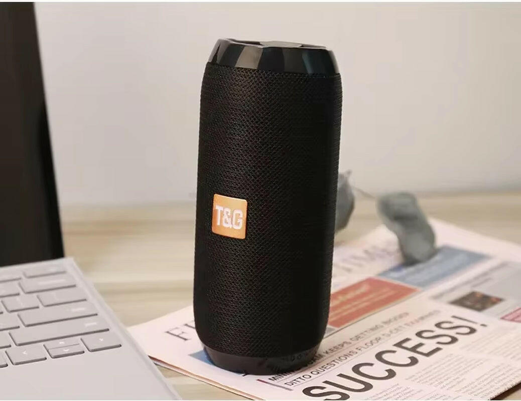 Waterproof Portable Bluetooth Speaker with Subwoofer, AUX, and FM Radio Functionality.